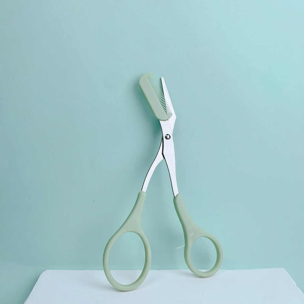 Pink eyebrow trimming scissors with built-in comb - stainless steel, precise grooming tool, creating perfect eyebrows